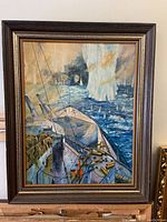 Full view of the framed oil painting showing a naval battle scene with ships and water