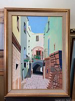 Full view of framed oil painting showing Mediterranean street scene