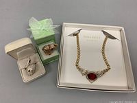 Photo showing all three items: Nina Ricci choker necklace and two crystal animal rings in boxes
