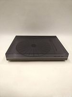 Front view with dust cover closed showing overall form