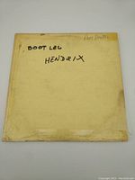 Front side of worn, yellowed paper cover with handwritten 'BOOT LEG HENDRIX'