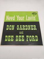 Front cover of the vinyl record titled 'Need Your Lovin'' by Don Gardner and Dee Dee Ford, showing green and black design with artist names prominently on front.