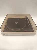 Full front view of the dual 506 record player with dust cover closed showing overall appearance and condition.