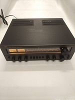 Front view showing chassis, tuning window, meters and control panel