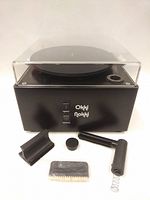 Front view of machine with turntable platen, controls and accessories in front