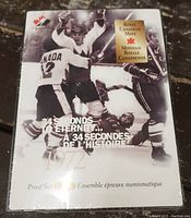 Photo showing the sealed original packaging with 1972 Summit Series hockey player imagery, Royal Canadian Mint logo, and multilingual text.