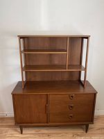 Front view of two-piece teak veneer hutch