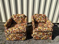 Front view of both chairs showing floral upholstery and general condition