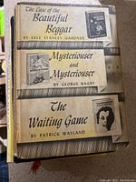 Three vintage book titles shown on a cover: The Case of the Beautiful Beggar, Mysterious and Mysterious, and The Waiting Game