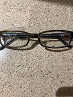 Top view of black rectangular eyeglass frames showing overall shape and design.