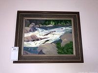 Full view of framed painting hung on wall