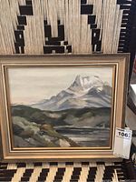Framed oil painting on board by Jo Walker showing an 11x13 mountain scene with water and rocky hills.