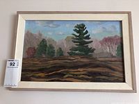 Frontal photo of the entire framed landscape oil painting showing overall condition and frame.