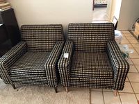 Front view of both chairs side by side showing plaid upholstery and overall condition