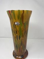 Front view of tall flared Murano glass vase on white background