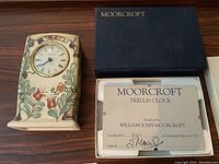 Moorcroft Trellis clock in original box with certificate signed by William John Moorcroft showing limited edition number 227 of 300.