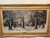Full front image of the framed vintage oil painting showing a winter landscape with snow-covered trees, signed by artist A. Mattes.