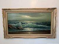 Full view of the painting in its carved wood frame, showing the ocean wave scene and overall size of 47 x 28 inches.