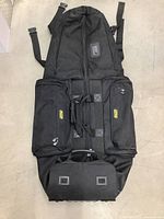 Full front view of the black Bag Boy golf travel bag showing zippered compartments, carrying handles, and adjustable shoulder straps.