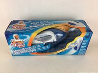 Mr Clean Magic Reach mop in original box, side view showing mop handle and packaging graphics.