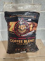 Full view of the 20lb black plastic bag of Northern Flames Coffee Blend wood pellets showing product branding and logo.