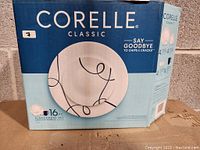 Box for Corelle Classic 16 Piece Dinnerware Set featuring white plates with blue swirl design