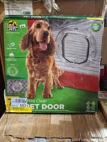 Front of the Hakuna Pets Ultra Clear pet door box showing a medium size dog and the product image with size details and condition label.