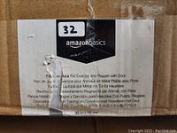 Close-up photo of Amazon Basics label on the product box showing product name and description in multiple languages.