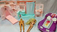 Photo showing entire set with fold-out bath/playhouse, fold-out bed, Barbie and Ken dolls, and purple Corvette car