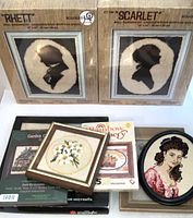 Shows full lot with boxed latch hook kits 'Rhett' and 'Scarlet' and several framed embroidery pieces and other boxed kits