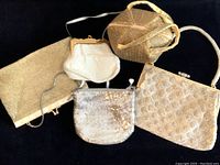 Top view of all five purses showing variety in sizes and beadwork