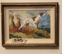Framed painting of a German Short Hair Pointer dog standing in a field, viewed from front at a slight angle, showing the gold-toned decorative frame and glass.