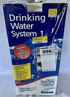 Front view of the original product box for Rainfresh Drinking Water System 1 with labels and price tags visible.