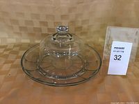 Full view of cheese tray with clear divided base and glass dome cover