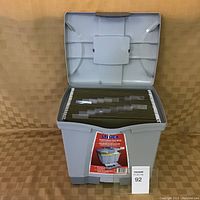 Gray portable file box open showing letter-sized hanging file folders inside.