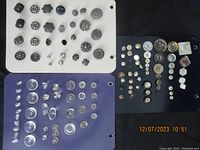 Photo of three cards with various vintage and antique buttons in multiple colors and designs