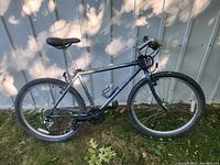 Side profile of the Trek 850 mountain bike showing the entire bike including frame, tires, gears, and saddle.