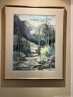 Full view of framed watercolor painting of forest and mountains