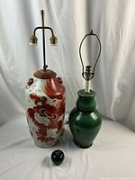 Overview of both lamps with size reference apple