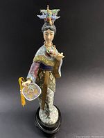 Front angled view of the cloisonné figure showing detailed enamel work and headdress