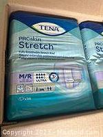 Photo of one box of TENA ProSkin Stretch adult diapers showing packaging details including size M/R and pack count 36.
