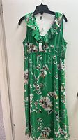 Green sleeveless floral dress on hanger, new with tags