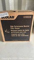 Cardboard box packaging of ECOLAB High Performance Neutral Floor Cleaner labeled with product code 6100036.