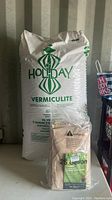 Full view of the Holiday Vermiculite 112 Litres bag and Vivosun 25 gallon fabric pot in packaging.