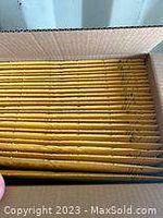 Photo of stacked JiffyLite yellow padded mailer envelopes showing the thickness and number of envelopes.