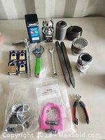 Photo of all tools laid out showing sockets, pliers, ratchet, and other hand tools