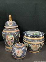Set of 3 blue and gold Chinese pottery pieces: large jar with foo lion lid, fish bowl, and small jar
