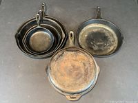 Overhead view of six cast iron pieces grouped together