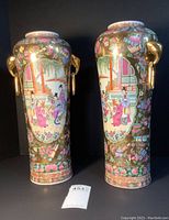 Pair of tall cylindrical vases shown front view