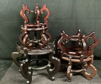 Group photo showing 5 stacked wooden stands of varying sizes and the smallest with a visible repair.